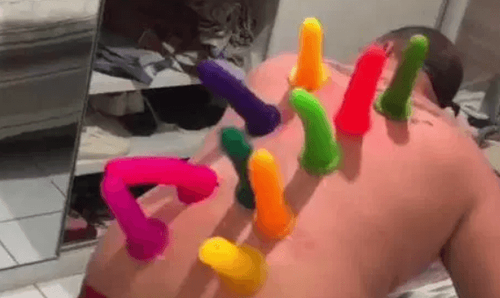 Prankster Glues Ten Dildos onto Friends Back While He Sleeps